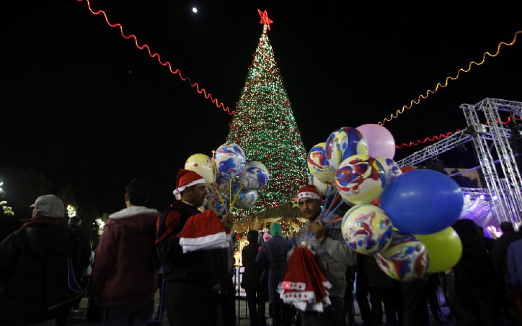 Armenian Christians celebrate Christmas in the courtyard of the Church of the Nativity in Bethlehem on Christmas Eve, December 24, 2012. (photo credit: Sliman Khader/Flash90) Armenian Christians celebrate Christmas in the courtyard of the Church of the Nativity in Bethlehem on Christmas Eve, December 24, 2012. (photo credit: Sliman Khader/Flash90)
