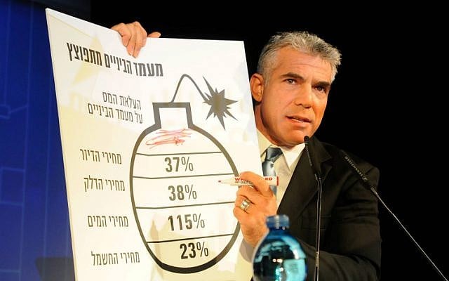 Yesh Atid party leader Yair Lapid presents a diagram mimicking Prime Minister Benjamin Netanyahu's bomb chart that he presented at the United Nations General Assembly in September. (photo credit: Flash90) Yesh Atid party leader Yair Lapid presents a diagram mimicking Prime Minister Benjamin Netanyahu's bomb chart that he presented at the United Nations General Assembly in September. (photo credit: Flash90)