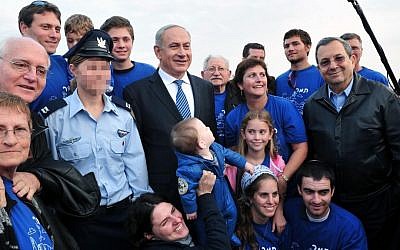 Prime Minister Benjamin Netanyahu and Defense Minister Ehud Barak at the Air Force Flight Academy graduation ceremony at the Hatzerim air force base in the Negev, December 27, 2012. (photo credit: Ariel Hermoni/Ministry of Defence/Flash90)