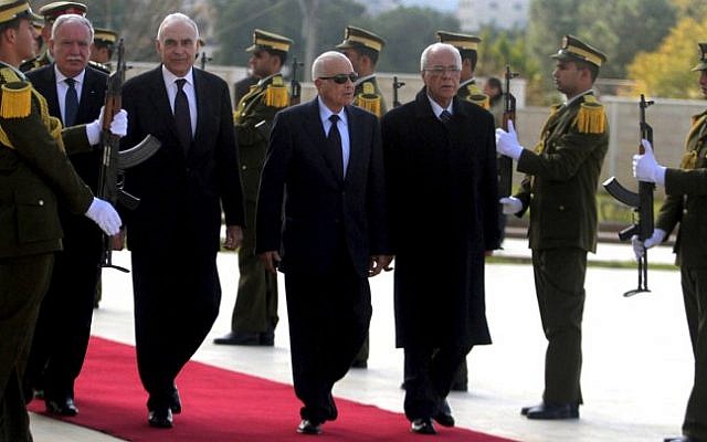 Arab League Secretary General Nabil Elaraby, second right, and Egyptian Foreign Minister Mohammed Kamel Amr, third right, walk past an honor guard upon their arrival in Ramallah Saturday (photo credit: Issam Rimawi/Flash90) Arab League Secretary General Nabil Elaraby, second right, and Egyptian Foreign Minister Mohammed Kamel Amr, third right, walk past an honor guard upon their arrival in Ramallah Saturday (photo credit: Issam Rimawi/Flash90)