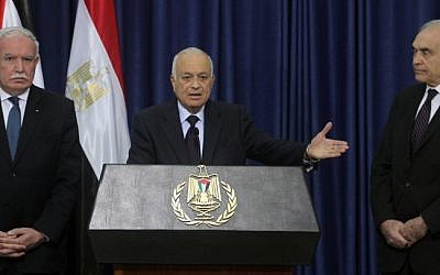 Arab League Secretary General Nabil Elaraby (center), flanked by Egypt's Foreign Minister Mohamed Kamal Amr (right) and Palestinian Foreign Minister Riyad al-Maliki (left), speaks during a press conference upon his arrival in Ramallah Saturday (photo credit: Issam Rimawi/Flash90)