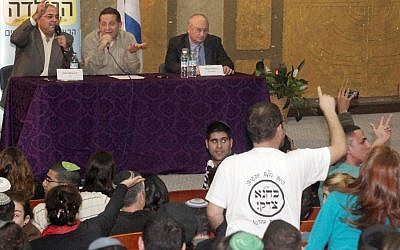 Arab Israeli parliament member Ahmad Tibi (left) and right-wing parliament member Aryeh Eldad of the Power to Israel (Otzma l'Yisrael) party at a panel debate at Bar-Ilan University on Sunday (photo credit: Markowicz/Flash90)
