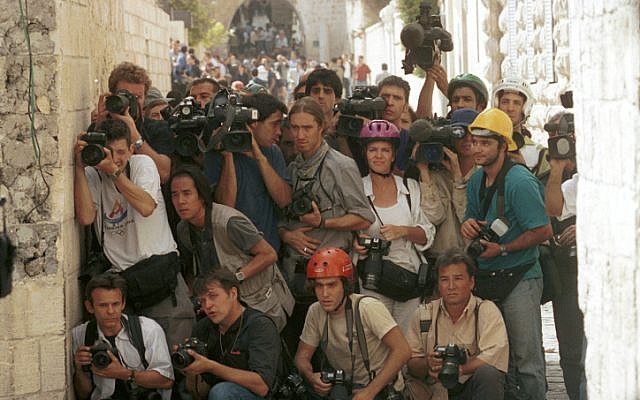 Foreign journalists cover clashes between Israelis and Palestinians in 2000. (photo credit: Nati Shohat/Flash90) Foreign journalists cover clashes between Israelis and Palestinians in 2000. (photo credit: Nati Shohat/Flash90)