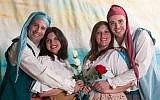 Gondoliers cast members Daniel Forst (Giuseppe) and Rafi Apfel (Marco) embrace their brides, Maya Cohen (Tessa) and Aviella Trapido (photo credit: Brian Negin)