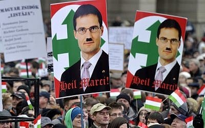 Poster of Hungarian far-right lawmaker Marton Gyongyosi (depicted with a Hitler mustache), at a mass protest against Nazism in Budapest, December 2, 2012 (photo credit: AP/MTI/Laszlo Beliczay)