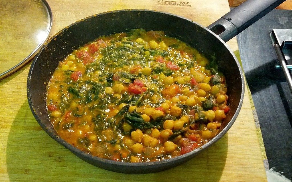 Baby spinach, chickpeas and tomatoes on a base of water-sauteed onions and spices (Courtesy Phyllis Glazer) Baby spinach, chickpeas and tomatoes on a base of water-sauteed onions and spices (Courtesy Phyllis Glazer)
