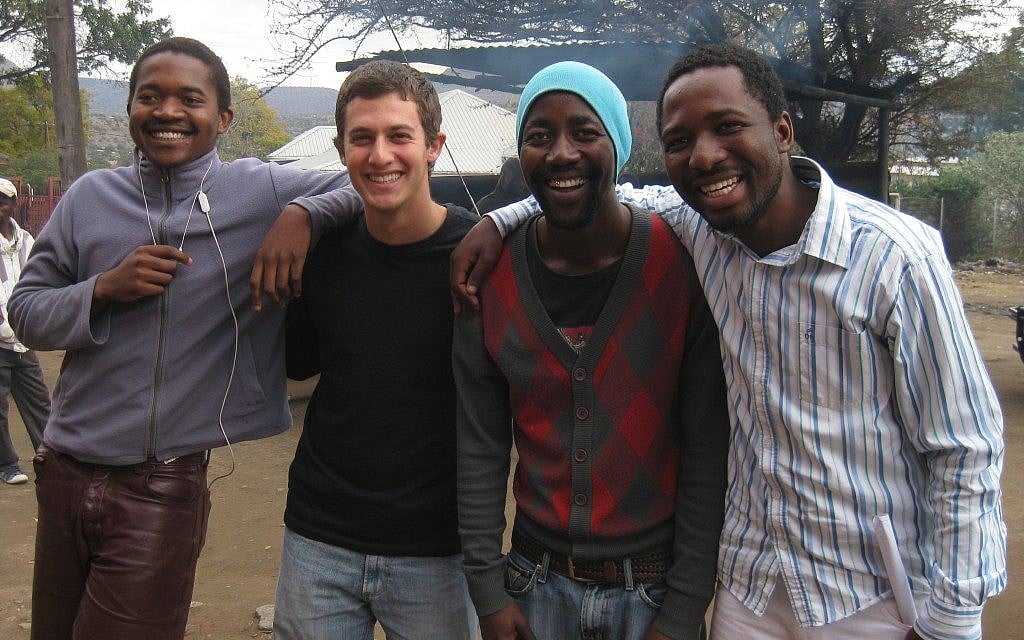 Rhodes scholar David Carel, second from left, regularly travels to South Africa to work on global health issues, but finds time on the side to teach Israeli folk dancing. (Courtesy of David Carel) Rhodes scholar David Carel, second from left, regularly travels to South Africa to work on global health issues, but finds time on the side to teach Israeli folk dancing. (Courtesy of David Carel)