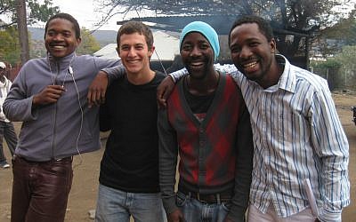 Rhodes scholar David Carel, second from left, regularly travels to South Africa to work on global health issues, but finds time on the side to teach Israeli folk dancing. (Courtesy of David Carel)