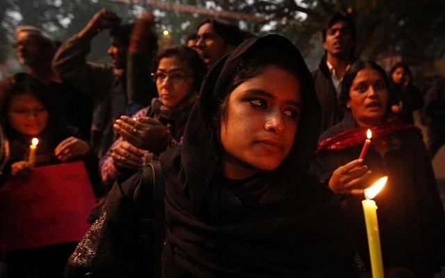In this Dec. 26, 2012 photo, Indians participate in a candle light vigil to seek a quick recovery of the young victim of the recent brutal gang rape in a bus in New Delhi, India. A statement by Singapore’s Mount Elizabeth hospital, where the 23-year-old victim was being treated, said she died Saturday. (photo credit: AP Photo/Saurabh Das) In this Dec. 26, 2012 photo, Indians participate in a candle light vigil to seek a quick recovery of the young victim of the recent brutal gang rape in a bus in New Delhi, India. A statement by Singapore’s Mount Elizabeth hospital, where the 23-year-old victim was being treated, said she died Saturday. (photo credit: AP Photo/Saurabh Das)