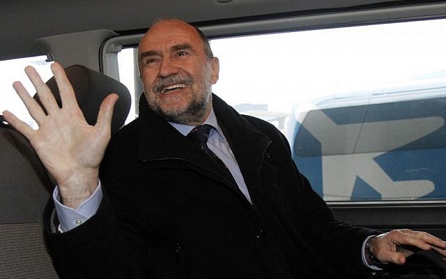 Deputy Director General and Head of the Department of Safeguards of the International Atomic Energy Agency Herman Nackaerts waves as he arrives from Iran at Vienna's Schwechat airport, in Austria, on Friday (photo credit: AP/Ronald Zak)