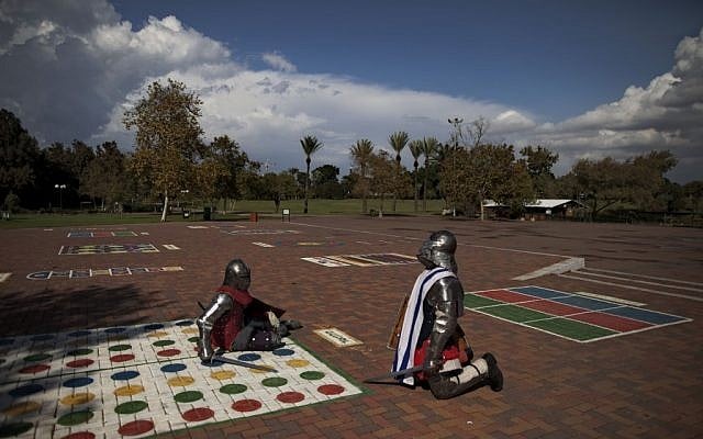 Immigrants from the former Soviet Union practice sword-fighting in full knight armor, in a public park in Ramat Gan, central Israel. Medieval combat simulation is popular in ex-Soviet countries and some immigrants have continued the hobby in Israel (photo credit: AP Photo/Oded Balilty)