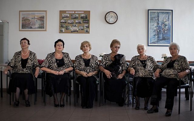 A choir practices in a government-funded elderly care facility catering to Russian-speaking immigrants in Ashdod, southern Israel. The choir sings Russian standards and Israeli folk songs translated into Russian. (photo credit: AP Photo/Oded Balilty) 