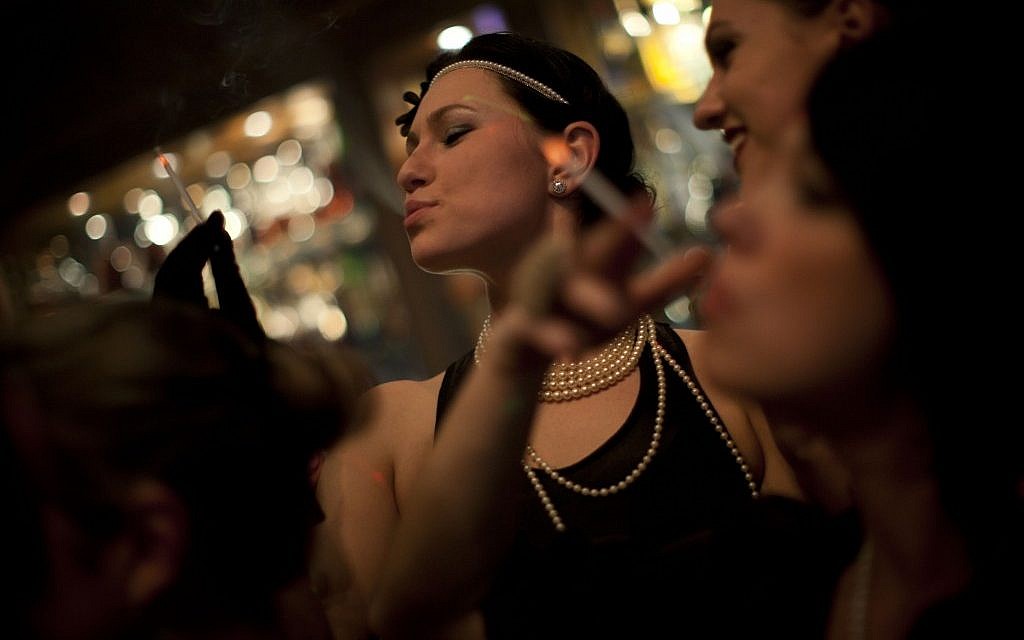 Russian-speaking Israelis dance to Russian pop beats at the Babylon nightclub in Tel Aviv. The club caters to the Russian-speaking immigrant community, featuring hired dancers and extravagant decorations rarely seen in informal Israel (photo credit: AP/Oded Balilty)