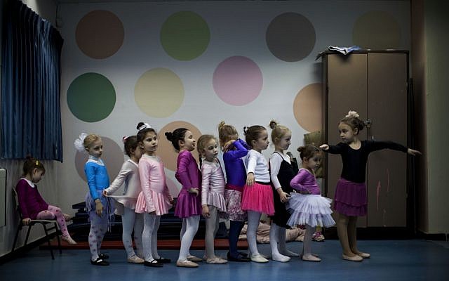Children of immigrants from the former Soviet Union attend a ballet class in Lod, central Israel. Some prominent ballet dancers left the former Soviet Union for Israel, forming ballet schools and continuing a dance culture highly regarded in their countries of origin (photo credit: AP Photo/Oded Balilty)