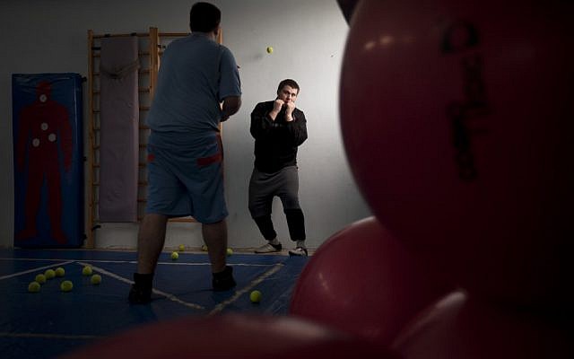 Russian-speaking Israeli immigrants train in a boxing club in Ashdod, a southern city heavily populated by immigrants from the former Soviet Union (photo credit: AP Photo/Oded Balilty)