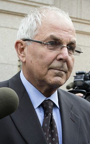 Peter Madoff, who pleaded guilty to criminal charges in June, reportedly kissed a Torah at his granddaughter's bat mitzvah. (John Minchillo/AP)