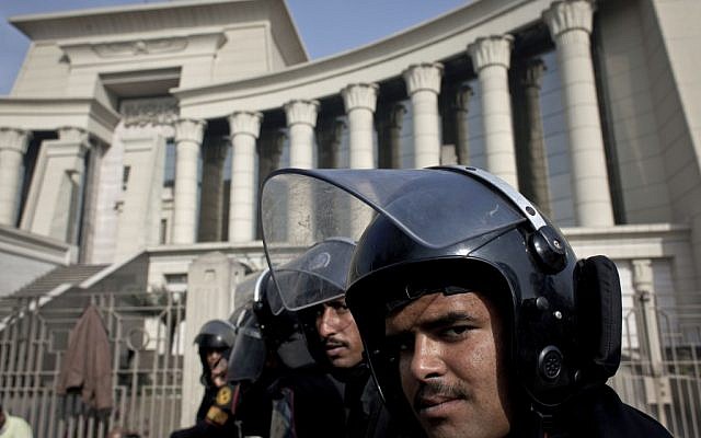 Illustrative photo of riot policemen standing guard in front of Egypt’s top court, in Cairo, Egypt, Monday, December 3, 2012 (photo credit: AP/Nasser Nasser) Illustrative photo of riot policemen standing guard in front of Egypt’s top court, in Cairo, Egypt, Monday, December 3, 2012 (photo credit: AP/Nasser Nasser)