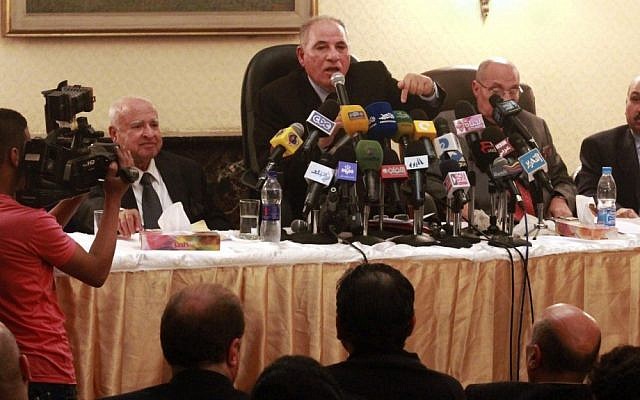 Head of the powerful Egypt Judges Club Ahmed el-Zind (center) speaks at a press conference on Sunday, announcing that judges will not oversee the Dec. 15, 2012 referendum to approve a contentious draft constitution in Cairo (photo credit: Ahmed Ramadan/AP)