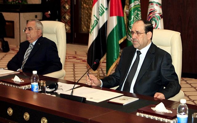 Iraqi Prime Minister Nouri al- Maliki, right, and Palestinian Prime Minister Salam Fayyad, left, attend the International conference in solidarity with Palestinian, Arab prisoners, and detainees in Israel, in Baghdad, Iraq, Tuesday, Dec. 11 (photo credit: AP/Karim Kadim)