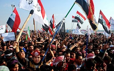 Protesters chant slogans against Iraq's Shiite-led government in Ramadi, 70 miles (115 kilometers) west of Baghdad, Iraq, Sunday, Dec. 30, 2012. (Photo credit: AP)
