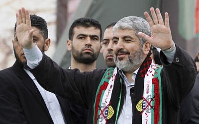 Hamas chief Khaled Mashaal waves to Hamas supporters during a rally to commemorate the group's 25th anniversary in Gaza city, Saturday, Dec. 8, 2012 (AP/Hatem Moussa)