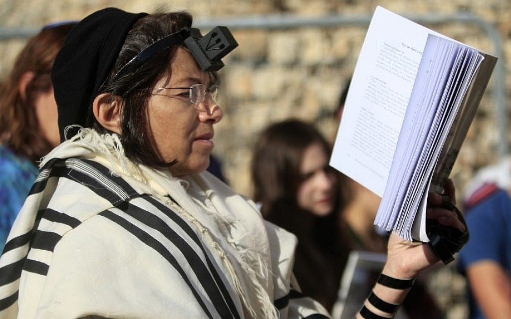An Israeli member of the Women of the Wall organization prays just outside the Western Wall in Jerusalem's Old City on Friday (photo credit: AP/Dan Balilty) An Israeli member of the Women of the Wall organization prays just outside the Western Wall in Jerusalem's Old City on Friday (photo credit: AP/Dan Balilty)