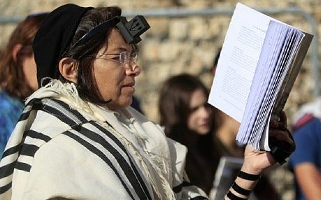 An Israeli member of the Women of the Wall organization prays just outside the Western Wall in Jerusalem's Old City (photo credit: AP/Dan Balilty) An Israeli member of the Women of the Wall organization prays just outside the Western Wall in Jerusalem's Old City (photo credit: AP/Dan Balilty)