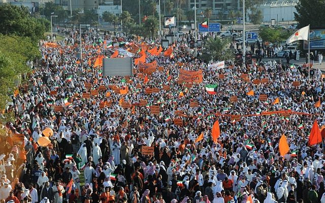 Islamist, nationalist and liberal opposition groups gather on Friday to protest the Kuwaiti government's amendment of the electoral law, and to support a boycott of the country's election. (photo credit: AP/Gustavo Ferrari)