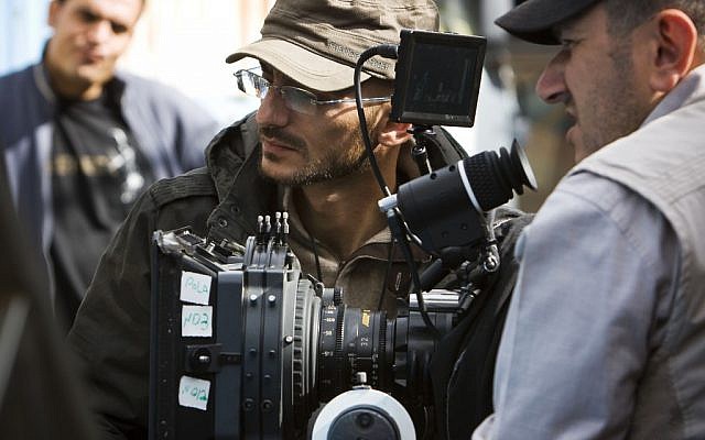 Syrian filmmaker Joud Said, center, works on a film set in Damascus, Syria, in November 2011 (photo credit: AP/Nora Fahham)