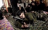 In this Monday, December 17, 2012 photo, Syrian rebels listen to their trainer teaching them how to use the RPG in Maaret Ikhwan, near Idlib, Syria (photo credit: AP/Mohammed Muheisen)