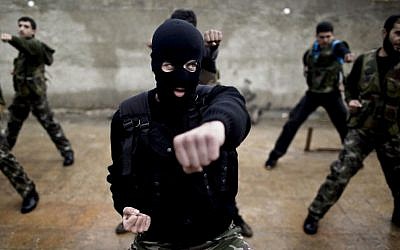 Syrian rebels attend a training session in Maaret Ikhwan, near Idlib, Syria, on Monday, Dec. 17, 2012. (photo credit: Muhammed Muheisen/AP)