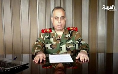 In this image made from video broadcast on Al Arabiya TV late Tuesday, Dec. 25, 2012, Syrian Maj. Gen. Abdul-Aziz Jassem al-Shallal says he is joining 'the people's revolution.'(photo credit: AP/Al Arabiya)