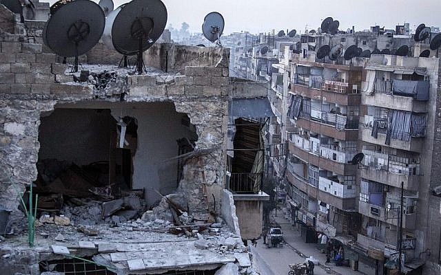 A destroyed building in Aleppo, Syria, on Thursday after airstrikes targeted the area. (photo credit: AP Photo/Narciso Contreras)