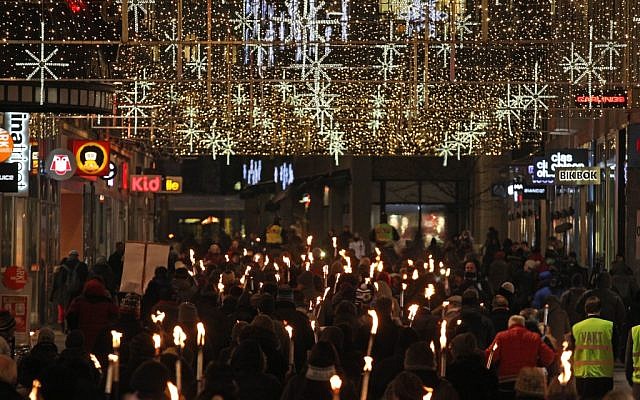 People walk with torches to protest against the awarding of the Nobel Peace Prize to the EU bloc in Oslo, Norway, Sunday December 9, 2012 (photo credit: AP/Yves Logghe) People walk with torches to protest against the awarding of the Nobel Peace Prize to the EU bloc in Oslo, Norway, Sunday December 9, 2012 (photo credit: AP/Yves Logghe)