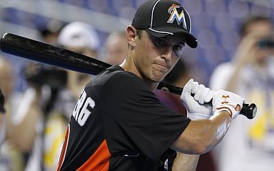 Adam Greenberg, as a Miami Marlin for one day, preparing for batting practice before the baseball game in which he pinch-hit against the New York Mets in Miami on October 2, 2012. (photo credit: Alan Diaz, AP)