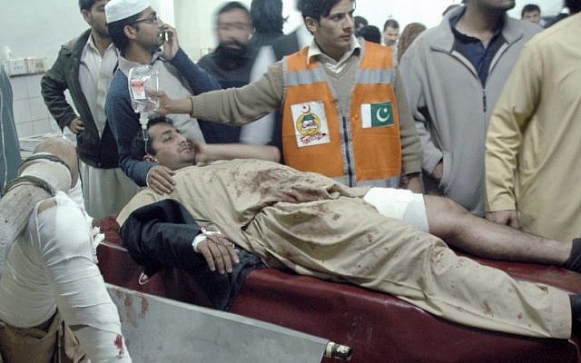 Injured victims of a suicide bombing are treated at a local hospital in Peshawar, Pakistan, Saturday, Dec. 22, 2012. A suicide bomber in Pakistan killed several people, including a provincial government official, at a political rally held Saturday by a party that has opposed the Taliban, officials said. (AP Photo/Mohammad Sajjad) Injured victims of a suicide bombing are treated at a local hospital in Peshawar, Pakistan, Saturday, Dec. 22, 2012. A suicide bomber in Pakistan killed several people, including a provincial government official, at a political rally held Saturday by a party that has opposed the Taliban, officials said. (AP Photo/Mohammad Sajjad)