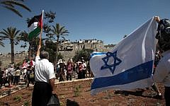 Israeli and Palestinian peace activists marching outside Jerusalem's Old City July 15, 2011 (photo credit: Yossi Zamir/Flash 90)