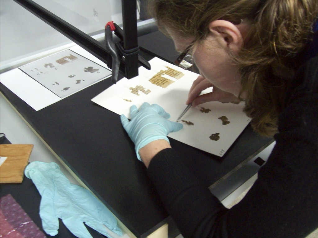 An IAA conservator working on scroll fragments (Photo credit: Shai Halevy/Israel Antiquities Authority) An IAA conservator working on scroll fragments (Photo credit: Shai Halevy/Israel Antiquities Authority)