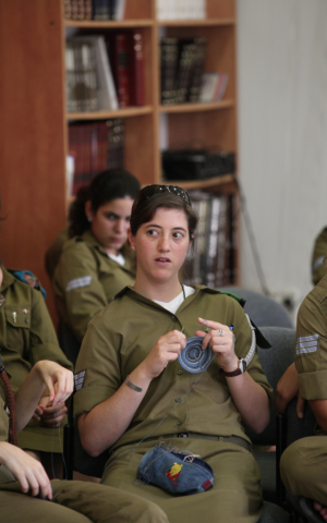 A soldier knitting during a class in the army (Photo credit: Ofir David courtesy of Aluma) 