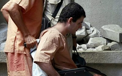 Iranian national Saeid Moradi is wheeled into a Bangkok criminal courtroom, December 2012 (photo credit: AP/Apichart Weerawong)