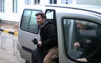 In this image made from video, NBC chief foreign correspondent Richard Engel exits a car after crossing back into Turkey, after being freed from five days of captivity inside Syria (photo credit: AP/Anadolu)