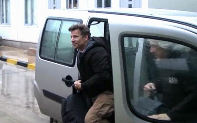 In this image made from video, NBC chief foreign correspondent Richard Engel exits a car after crossing back into Turkey, after being freed from five days of captivity inside Syria (photo credit: AP/Anadolu)