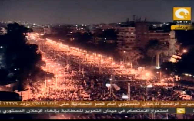 Thousands of protesters congregate in Cairo near the presidential palace on Tuesday. (photo credit: image capture from ONTV) Thousands of protesters congregate in Cairo near the presidential palace on Tuesday. (photo credit: image capture from ONTV)