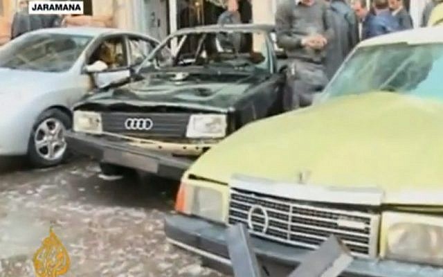 Cars harmed by an explosion in Damascus, Wednesday (photo credit: screen capture AlJazeeraEnglish/Youtube)