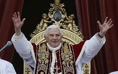 Pope Benedict XVI delivers his "Urbi et Orbi" (to the City and to the World) speech from the central loggia of St. Peter's Basilica, at the Vatican, on Tuesday, December 25, 2012. (photo credit: AP Photo/Gregorio Borgia)