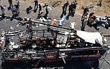 Police and paramedics inspect the scene after a suicide bomber blew himself up on a rush-hour bus near the Jerusalem neighborhood of Gilo during the Second Intifada, on June 18, 2002. (Flash90/File)