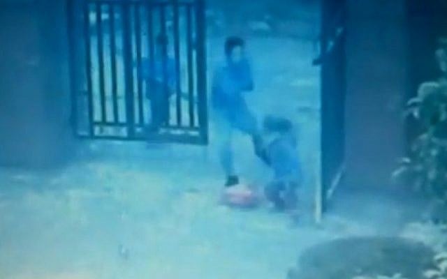 An assailant lashes out at a child in this grainy video footage released by the Chinese authorities from last week's school attack (photo credit: YouTube screenshot) An assailant lashes out at a child in this grainy video footage released by the Chinese authorities from last week's school attack (photo credit: YouTube screenshot)