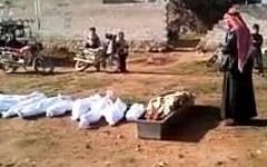 A mass burial in Syria on Saturday from a video uploaded by the Local Coordination Committees (photo credit: screen capture/Youtube)