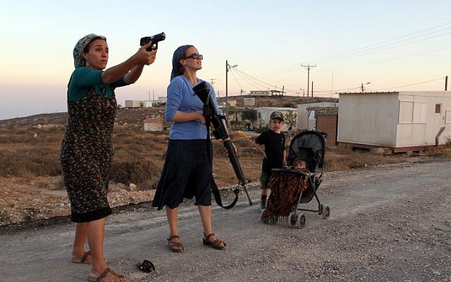 Female Jewish settlers practice firing weapons at the Jewish settlement of Pnei Kedem, near the West Bank city of Bethlehem, in September. (photo credit: Nati Shohat/Flash90) Female Jewish settlers practice firing weapons at the Jewish settlement of Pnei Kedem, near the West Bank city of Bethlehem, in September. (photo credit: Nati Shohat/Flash90)
