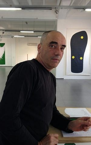 Artist Amnon Ben-Ami, winner of the Ilana Elovic-Bezalel award, at his 'Zephyr' exhibit in the Yaffo 23 gallery (photo credit: Jessica Steinberg/Times of Israel)
